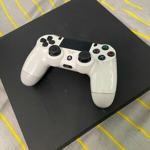 PS4 with controller. No cords. Could both use a cleaning but still works great.